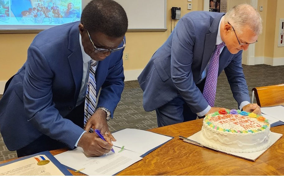 President Thomas Isekenegbe, BCC (left) and President Vincent Boudreau, CCNY (Right) signing the IICCCI MoU