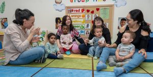 Babies and staff in early childhood center
