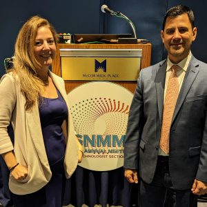 Two people in front of podium for Nuclear Medicine Tech