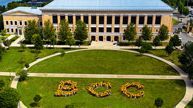 Fall Convocation Gathering on the Quad: Faculty and Staff gather together to spell out the letters BCC (soon from above)
