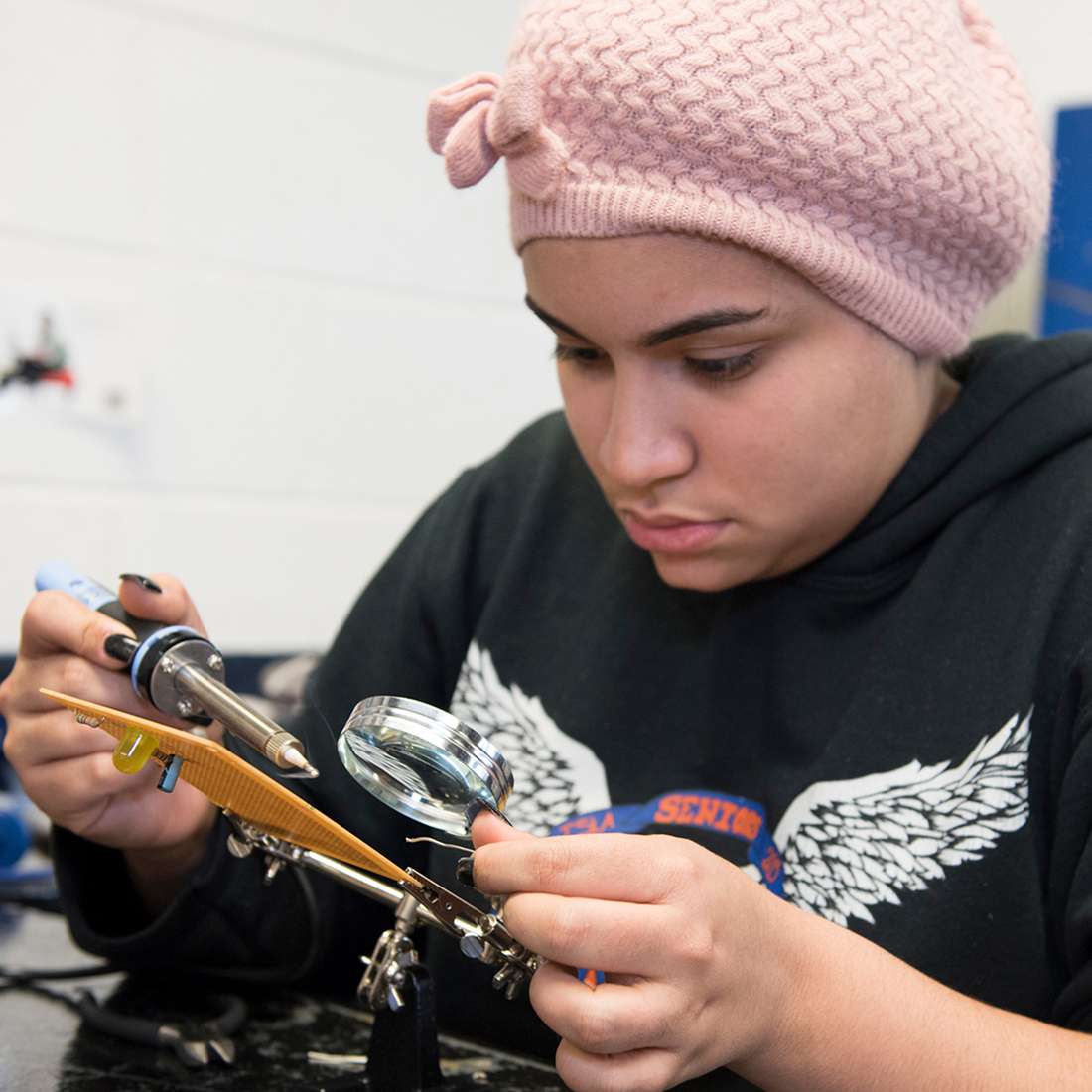 Girl working in electrical board