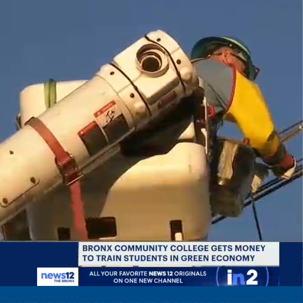Lineworker on a crane with headline: BCC gets Money to Train Students in Green Economy