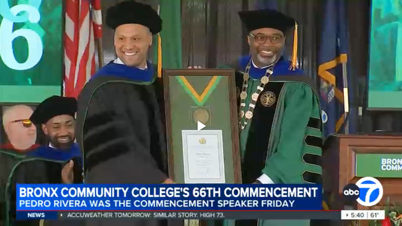 Still image from ABC7 broadcast about the 66th BCC Commencement, showing BCC President Larry D. Johnson, Jr. presenting an award to journalist Pedro Rivera